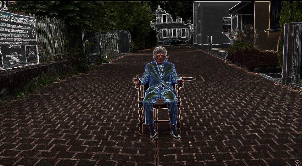 Theaterprojekt - Person auf Stuhl mit künstlerischem Neon-Effekt